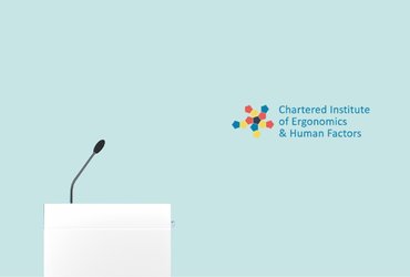 Podium with a gooseneck microphone against a light teal background, alongside the Chartered Institute of Ergonomics and Human Factors logo.