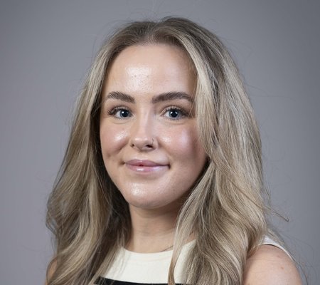 Corporate style head and shoulders portrait photo of Georgie Slater, Operations Coordinator at the Health Services Safety Investigations Body.