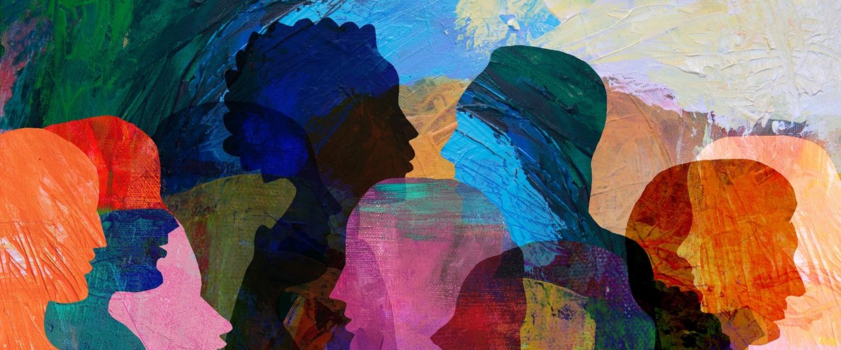 Illustration of multiple overlapping side-profile silhouettes of people facing each other, filled with bright, textured colours to represent discussion and diversity.