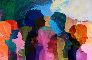Illustration of multiple overlapping side-profile silhouettes of people facing each other, filled with bright, textured colours to represent discussion and diversity.