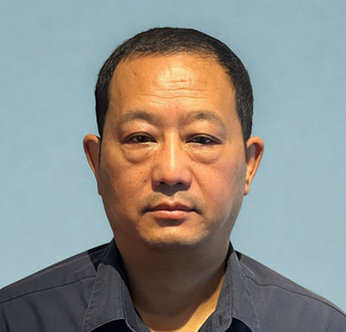 Head shot of Suraj Theeng, Operational Head of Finance.